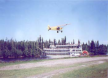 Bush Pilot taking off in front of Discovery